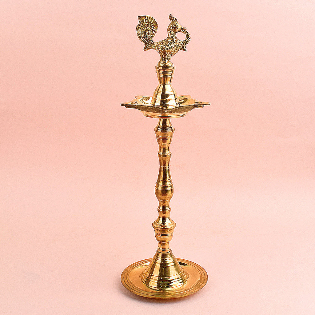 13.5 Inch Brass Peacock Kerala Diya – Handcrafted brass diya featuring an intricate peacock motif, ideal for grand pooja rituals, temple lighting, and traditional décor. India’s Largest Pooja Accessories Brand – www.satvikstore.in