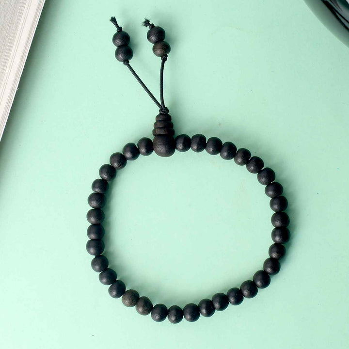 8mm Ebony Bracelet with Gloss Finish – polished black wooden beads with a shiny surface, designed for a refined and spiritual appearance. India’s Largest Pooja Accessories Brand - www.satvikstore.in 