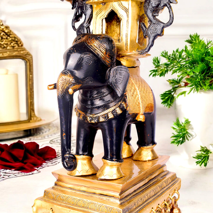  Large Brass Idol of 23 Inch Brass Chowki on Elephant with Hanging Bells. This 23 Inch Brass Chowki on Elephant with Hanging Bells is a stunning blend of artistry and tradition. Crafted from high-quality brass, the intricate detailing of the elephant and the delicately suspended bells add a touch of elegance to any space. 