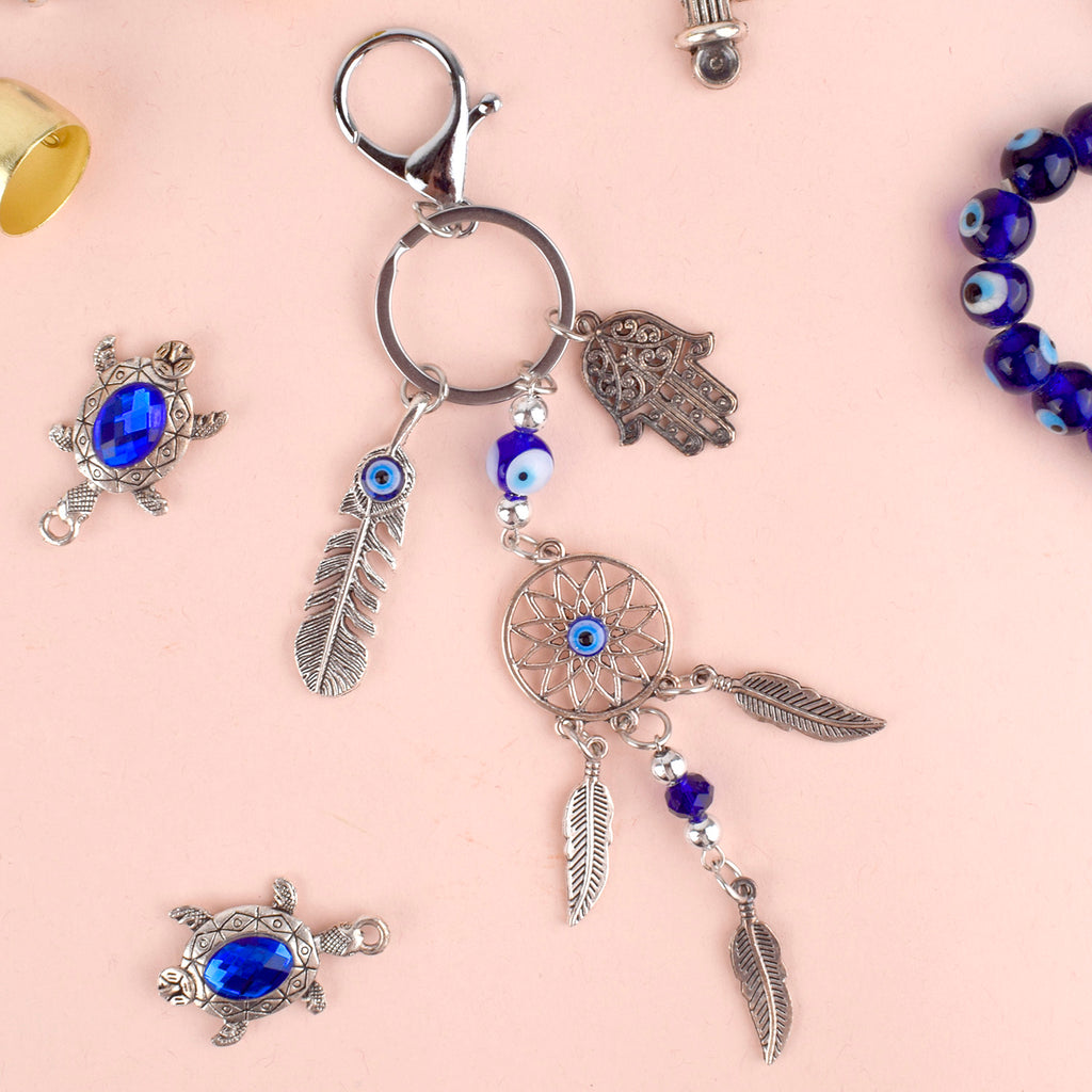 Blue Evil Eye Hamsa Leaf Dream Catcher Keychain – A spiritual and protective charm with the power of the Evil Eye and Hamsa hand. India’s Largest Pooja Accessories Brand – www.satvikstore.in