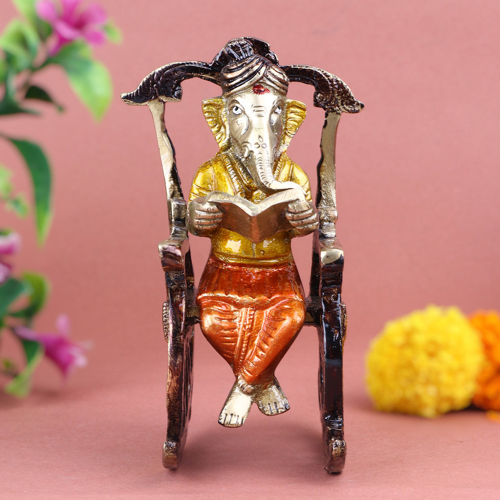 4.5 Inch Pure Brass Reading Book Ganesha Statue, beautifully crafted with intricate details of Lord Ganesha engrossed in reading, symbolizing wisdom, knowledge, and learning – ideal for study rooms. No.1 Brass Idol Store www.satvikstore.in 