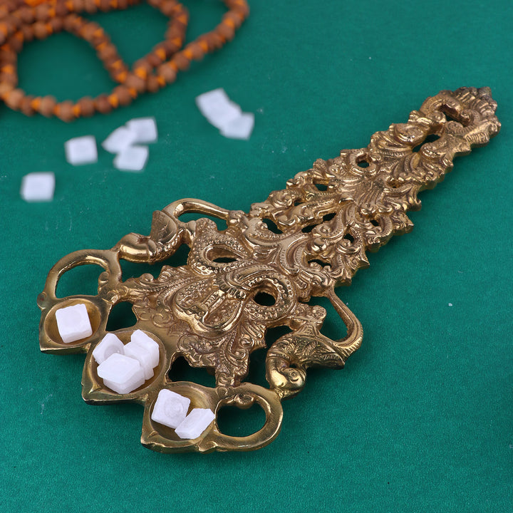 Designer Brass Trimukh Kapoor Aarti Spoon, a finely crafted brass spoon with a unique Trimukh design, used for performing aarti with Kapoor (camphor) during pooja and spiritual rituals. 
India’s Largest Pooja Accessories Brand – www.satvikstore.in 