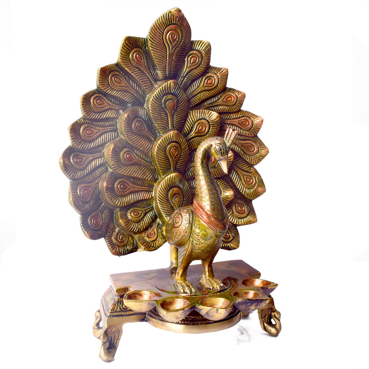 Satvik Stores Presents Stylish Peacock Panch Diya.&nbsp;Any festive occasion will be made wonderfully auspicious by the grace and beauty of the Peacock Brass Handcrafted Hanging Diya. Given that it was made by hand, the piece's abnormalities and flaws only serve to enhance Diya's allure and charisma. 