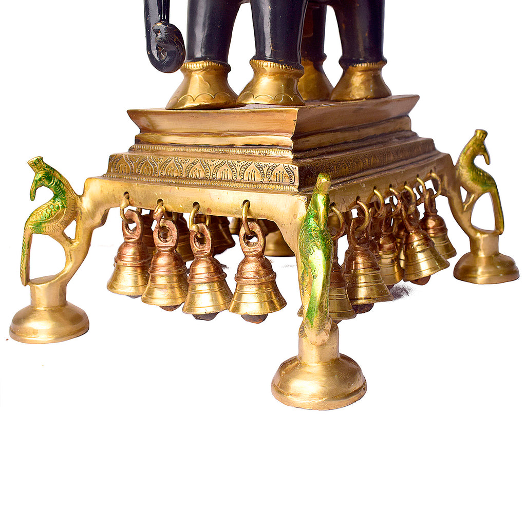Large Brass Idol of 23 Inch Brass Chowki on Elephant with Hanging Bells. This 23 Inch Brass Chowki on Elephant with Hanging Bells is a stunning blend of artistry and tradition. Crafted from high-quality brass, the intricate detailing of the elephant and the delicately suspended bells add a touch of elegance to any space. 