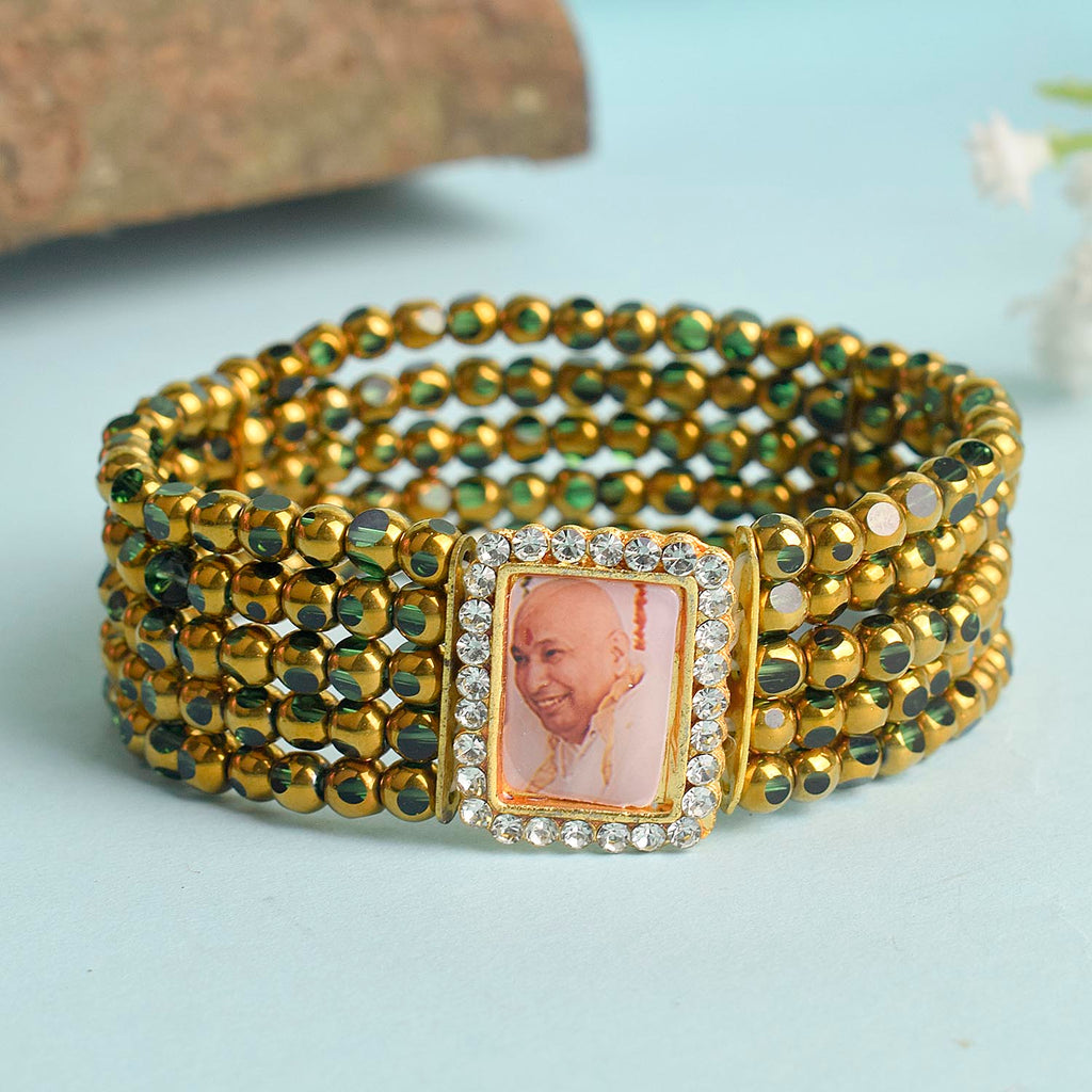 Five Layered Green & Golden Beads Guruji Swaroop Bracelet featuring vibrant layered beads and Jai Guruji Swaroop – perfect for spiritual wear, festive gifting, and daily devotion. India’s Largest Pooja Accessories Brand – www.satvikstore.in