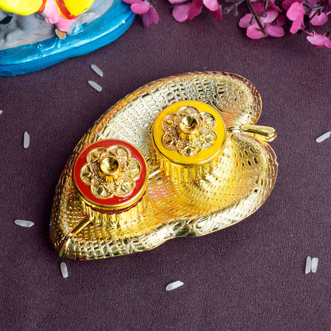 Leaf-shaped kumkum dispenser designed for rituals and pooja use, showcasing intricate craftsmanship and a traditional aesthetic for spiritual settings. India’s Largest Pooja Accessories Brand – www.satvikstore.in 