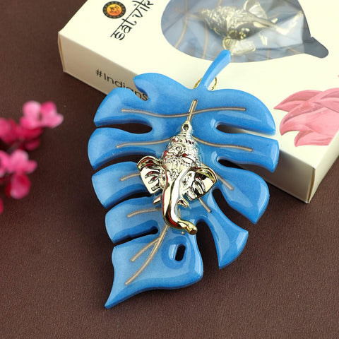 Elegant classic finish wall hanging featuring Lord Ganesha seated on a detailed leaf design, perfect for spiritual home decor and festive celebrations. India’s Largest Pooja Accessories Brand – www.satvikstore.in