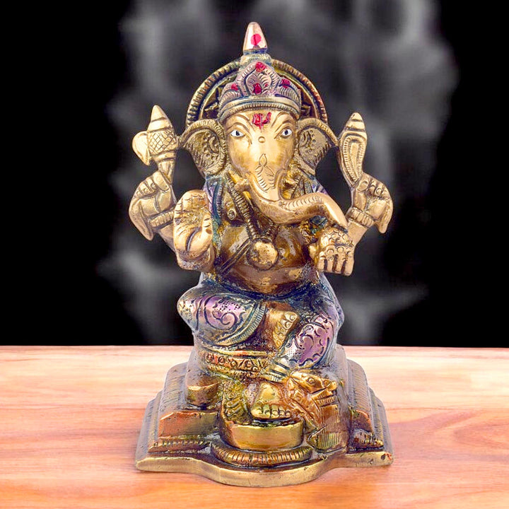 The "5.1 Inch Divine Ganesh Idol" is a beautifully crafted statue symbolizing wisdom, prosperity, and the removal of obstacles. Standing at 5.1 inches tall, this idol captures the serene and auspicious presence of Lord Ganesha, the beloved Hindu deity known for bringing good fortune and success. 