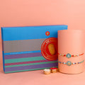 Designer Rakhi paired with delicious chocolates, perfect for Raksha Bandhan gifting.