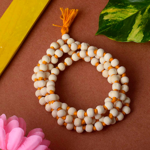 White Wooden Jaap Mala featuring smooth, light-colored beads strung together with a tassel, commonly used for meditation, mantra chanting, and spiritual practices. India’s Premium Jap Mala Store- www.satvikstore.in 