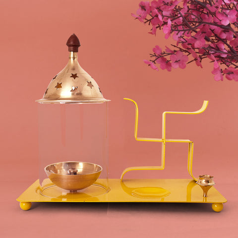 Yellow brass and metal Swastik chimney diya tray set featuring an integrated incense holder, ideal for daily puja rituals and auspicious spiritual decor. India’s Largest Pooja Accessories Brand – www.satvikstore.in