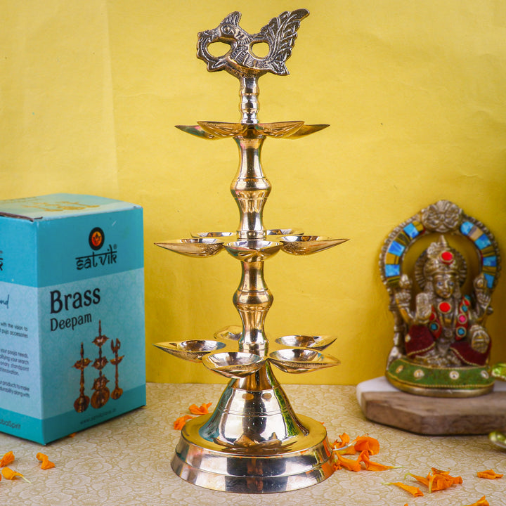 Brass 3 Step Panchmukhi Peacock Kerala Diya – Handcrafted brass diya with a three-step structure, Panchmukhi (five-faced) design, and peacock motif, perfect for pooja rituals, temple lighting, and traditional décor. India’s Largest Pooja Accessories Brand – www.satvikstore.in